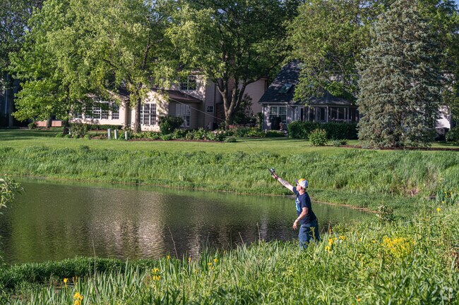 Local resident fishes at a pond in Winding Creek Park.
