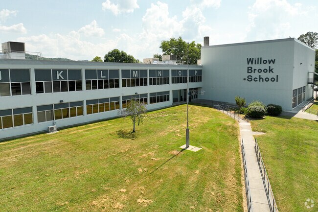 Willow Brook Elementary has a long walking path to the front entrance.