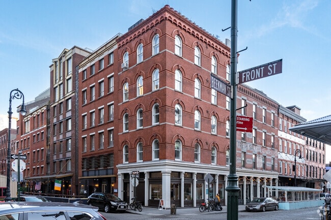 Red brick buildings showcase the historic architecture of NYC's roots.