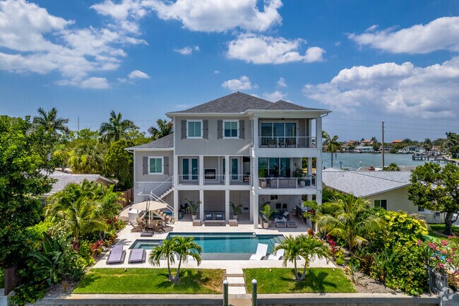 Multi-level coastal homes in Causeway Isles give it that Florida beach vibes.