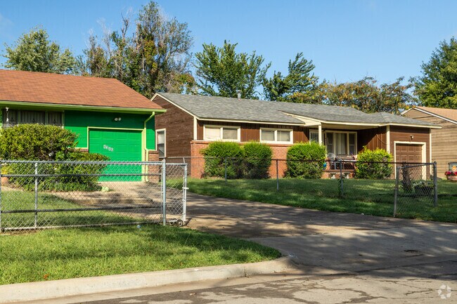 Bold colors and well-manicured landscaping are common in Suburban Acres.