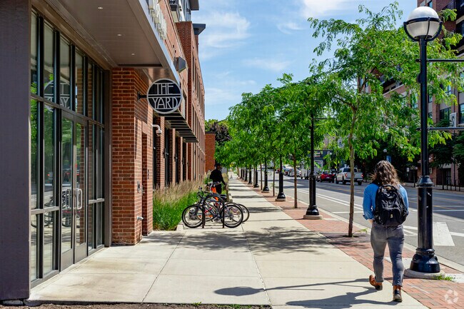 Wide sidewalks lined with trees lead directly from Elbel to downtown Ann Arbor.