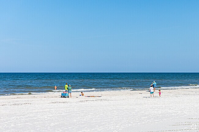Families have fun in the sun on North Cape San Blas's uncrowded white sand shoreline.