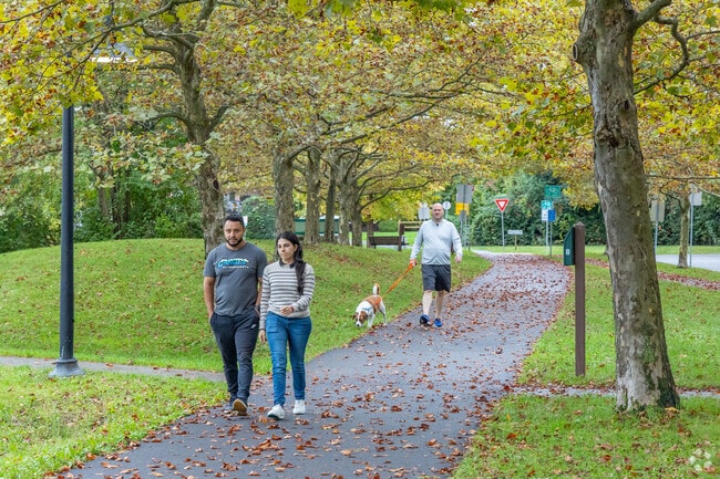 Residents of Orchard Park enjoy taking a stroll through its paved walking path.