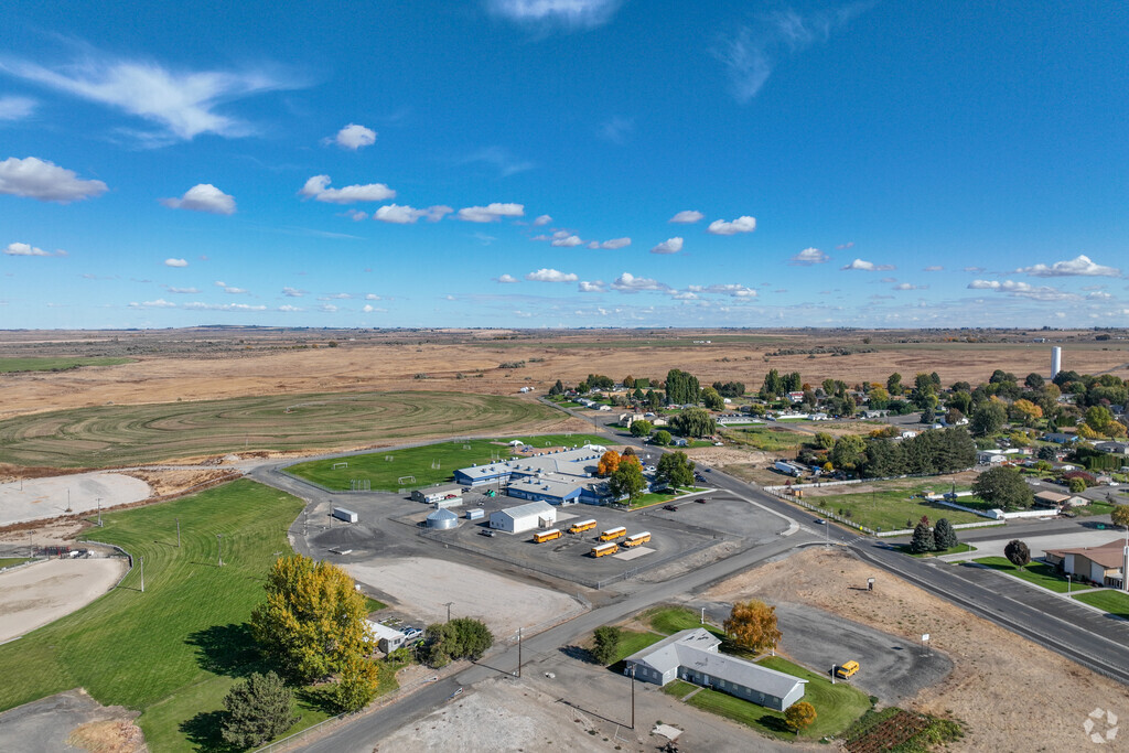 Active playgrounds and fields surround Basin City Elementary, inspiring young minds daily.