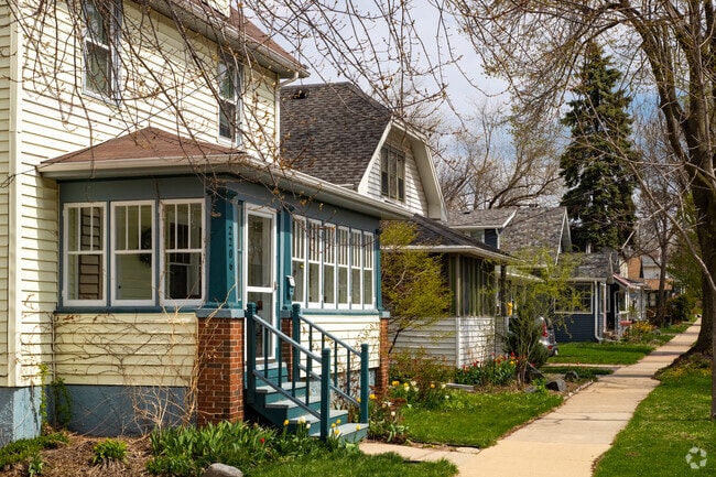 Modest two-story homes are shaded by large pine and oak trees in Emerson East.