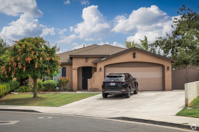 Yard features a flowering tree in the Venola neighborhood.