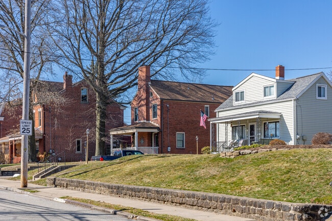 Some homes in Stanton Heights sit raised high off the road and require stairs.