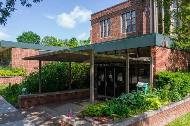 The front entrance to Bach Elementary School has a little free library.