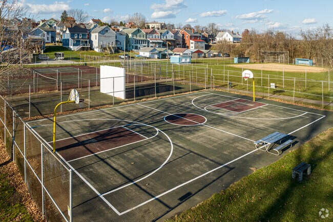 A full basketball court awaits friendly pickup games at Louck Park in Scottdale.