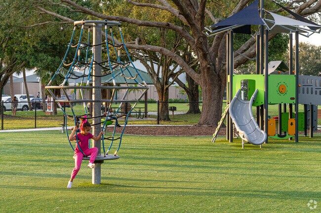 Whispering Pines Park offers several playground structures to entertain children.