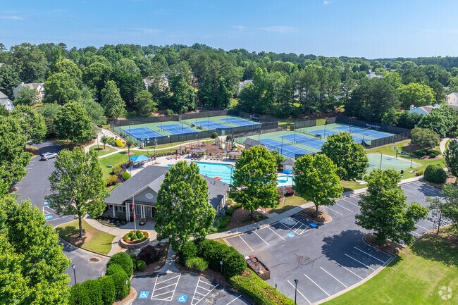 The heart of Wellington features a vibrant swim and tennis center surrounded by greenery—perfect for staying active and connecting with neighbors.