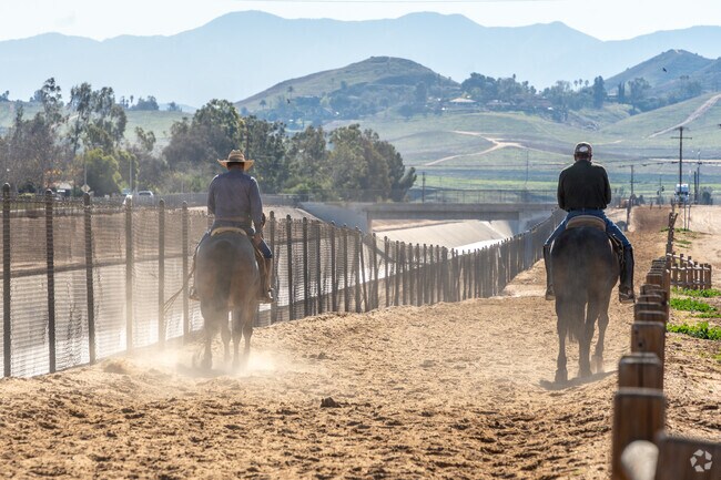Discover the charm of horse riders along the scenic roads of Mira Loma.