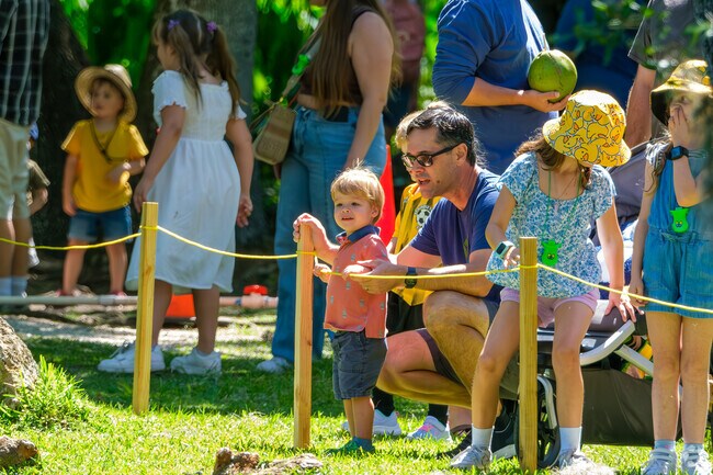 A young boy delights in watching The Great Duck Derby in Winter Park.