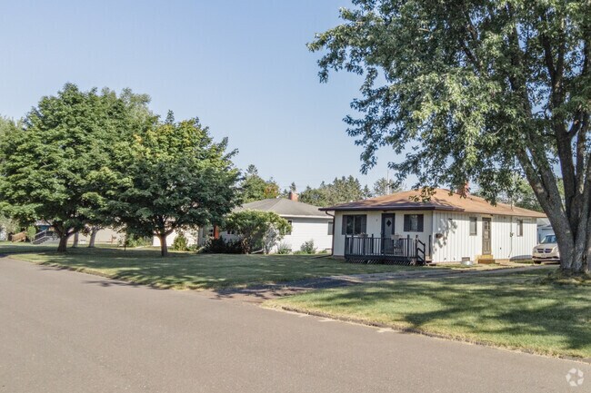 Some Central Park streets have lawns running all the way to the curb.