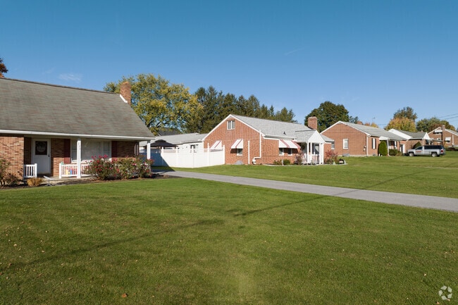 A row of brick ranch homes await your visit in Shrewsbury, PA.