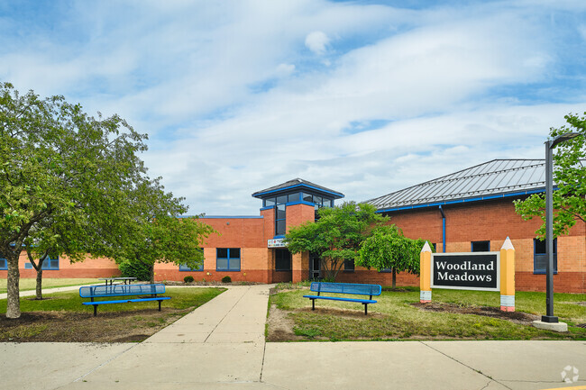 The entrance to Saline's Woodland Meadows has easy access by the main lot and a pickup lane.