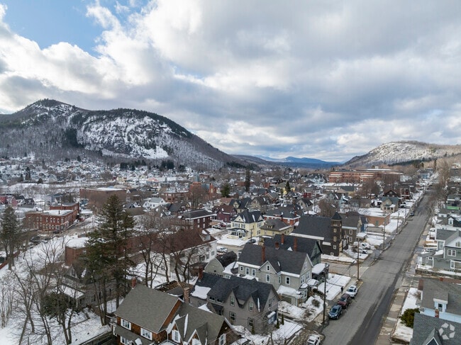 From the sky, Berlin's scenic beauty unfolds with winding rivers, mountain backdrops and a town rich in history.