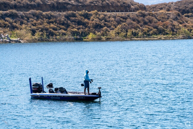 Scenic view of Diamond Valley Lake showcasing tranquil waters and surrounding hills, perfect for outdoor recreation in Riverside County.