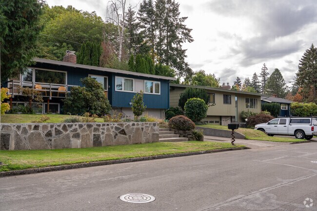 Colorful homes sprinkle the streets of the Mill Park neighborhood.