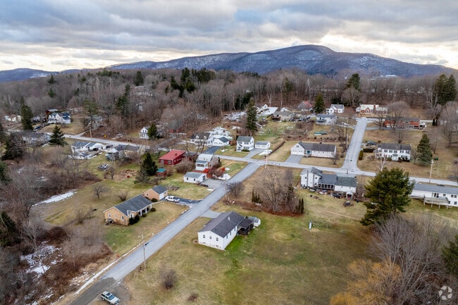 Rural homes sit along the hillsides of Bennington overlooking the city center.