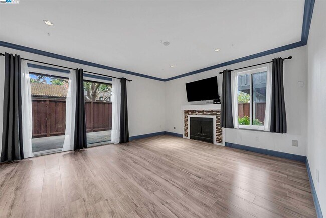 living room with wood burning fireplace