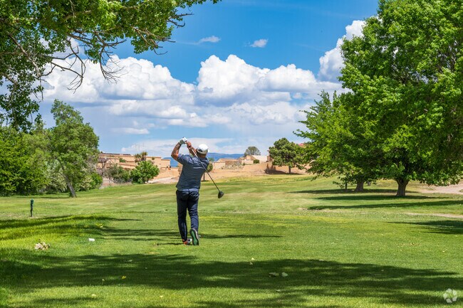 An Adelino resident enjoys a day on the greens at Tierra Del Sol Golf Club.