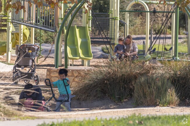 Kids enjoy the playground at Kellogg Park in Westside.
