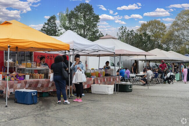 Vendors at the Starlight flea market sell everything from vintage clothing to fresh produce and home goods in Leila Valley.