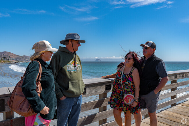 Have a chat with friends along the pier over looking Morro Bay's El Morro rock.