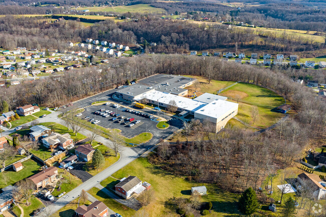 Most of West Point Elementary School is surrounded by forest.