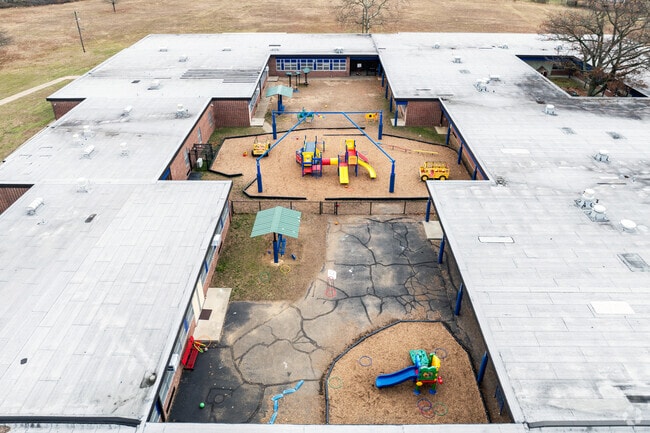 J  C  Stuart Elementary School has a playground in one of their courtyards.