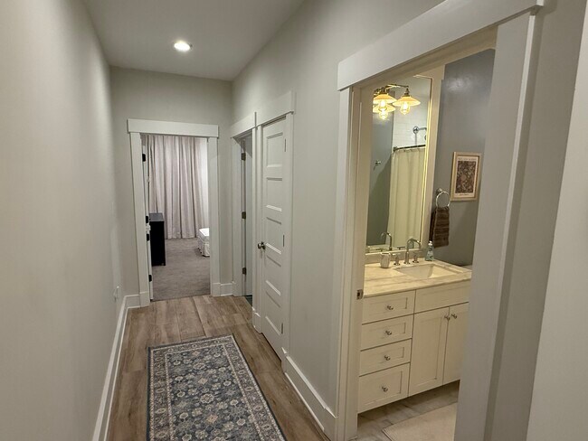 Hall to Bathroom, Laundry, and Bedrooms