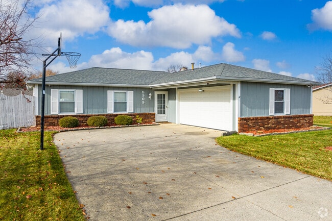 This Brandonwood ranch in Fort Wayne features a side entry garage.