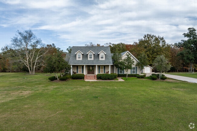 A large home sits on the banks of the Bayou Teche river in St Martinville, Louisiana.