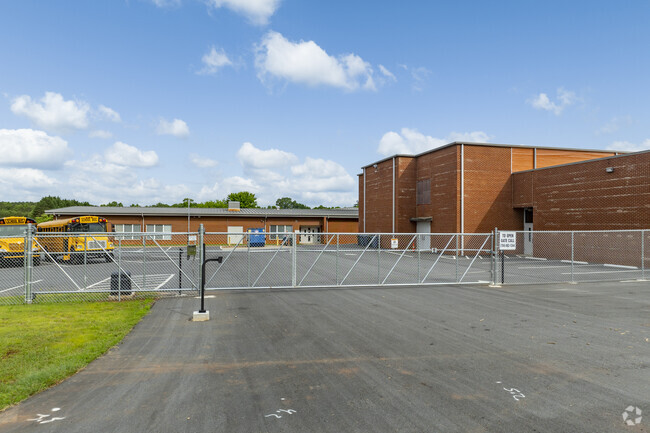 Bus riders are kept safe from other traffic in fenced bus loading zones at Blackburn Elementary.
