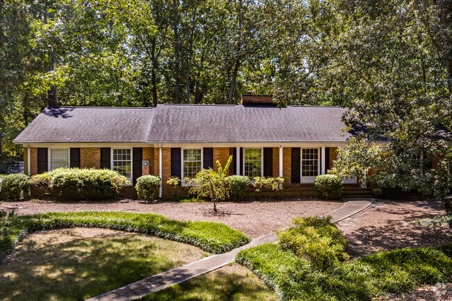 Most homes are surrounded by trees in the Duke Forest neighborhood.