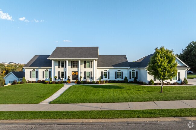 Large Colonial Estates in Grand Mere may have a 3 car garage, carriage house and border a pond.