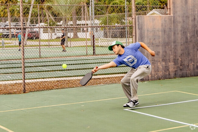 Pickleball games are common at parks near St. Lucie Village.
