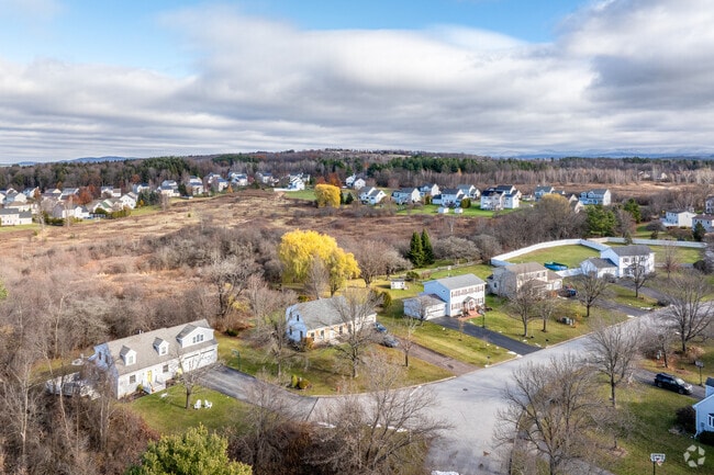 Homes in Williston sit among lush greenery, offering peaceful views of Vermont’s outdoors.