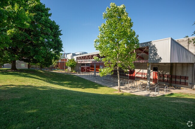 Harriet Tubman Middle School sits beneath large trees that offer shade from the morning sun.