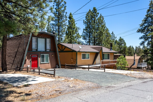 A row of quaint A-frame cabins graces the landscape of Big Bear City.