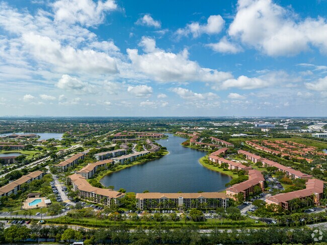 Century Village is surrounded by clear blue lakes, lush greenery and a Golf Course.