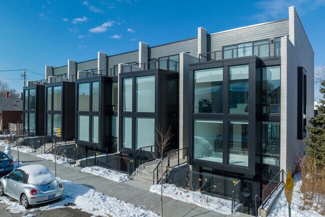 Architecturally modern buildings blend sleek design with sustainable features in Corktown.