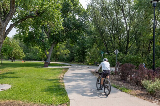 Martin Park's shaded paths invite leisurely bike rides and peaceful strolls.
