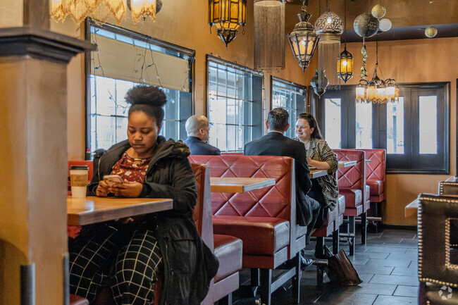 People have a great time eating and chatting in West End.