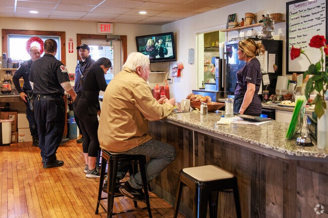 Firefighters from the Nedrow Fire Station stop into Sweet Grass Diner in Nedrow for lunch.