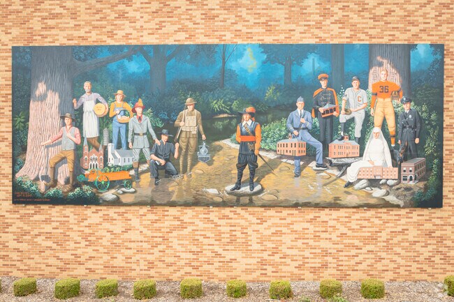Mural in downtown Coldwater, Ohio celebrates local history, labor, sports, and community pride.