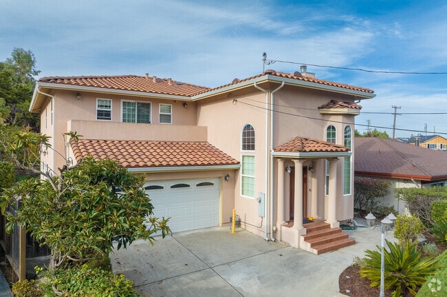 A  mid century spanish revival style home in Antique Forest Homes.