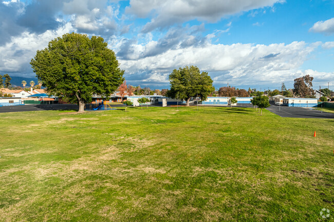Barfield Elementary School offers large grassy fields that students run freely on.